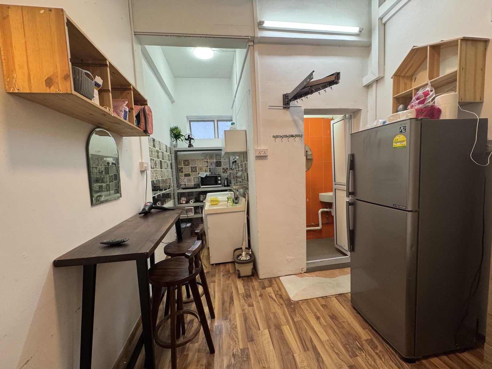 Kitchen, fridge and dining bar